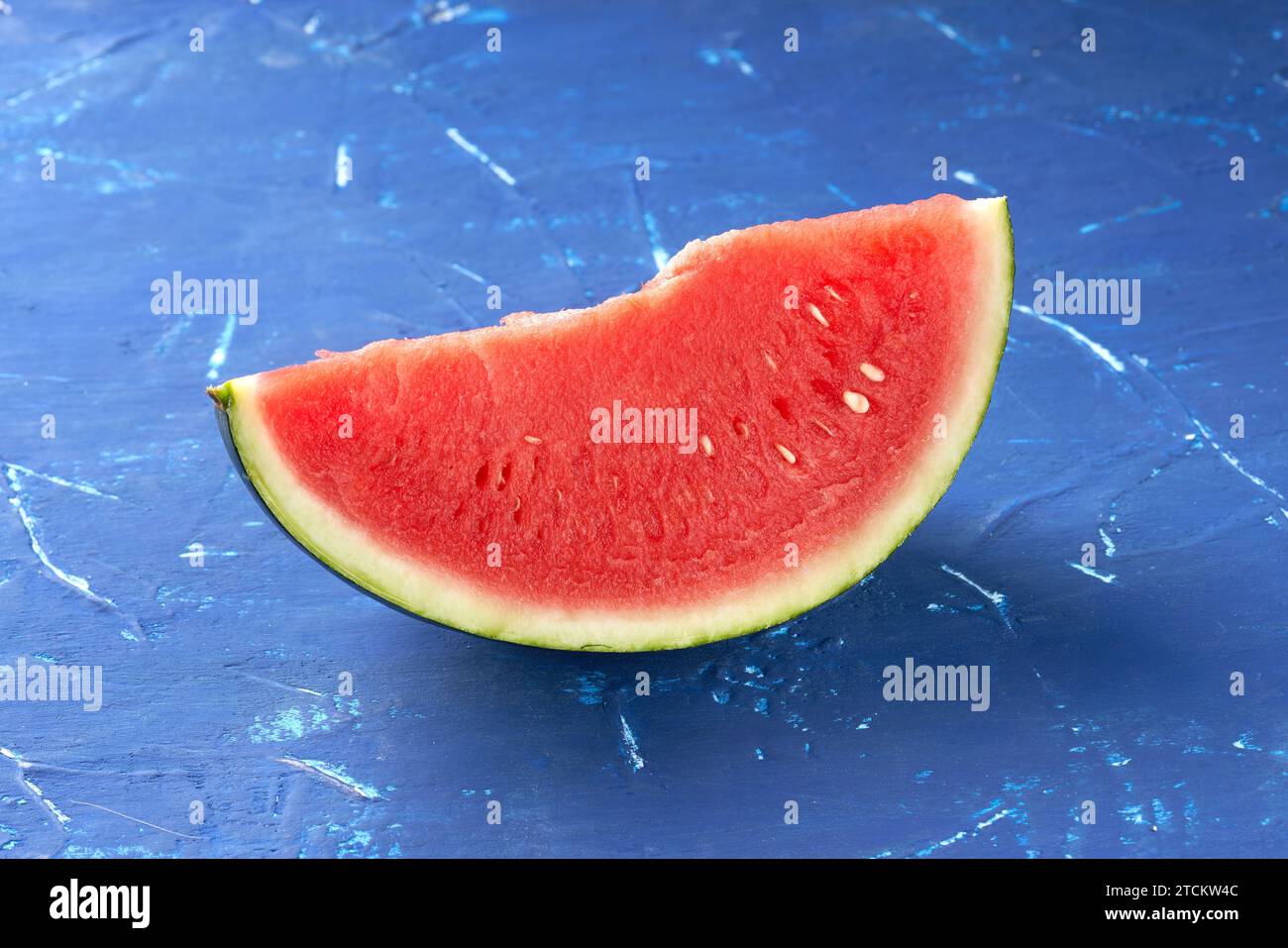 red juicy watermelon on a blue background Stock Photo