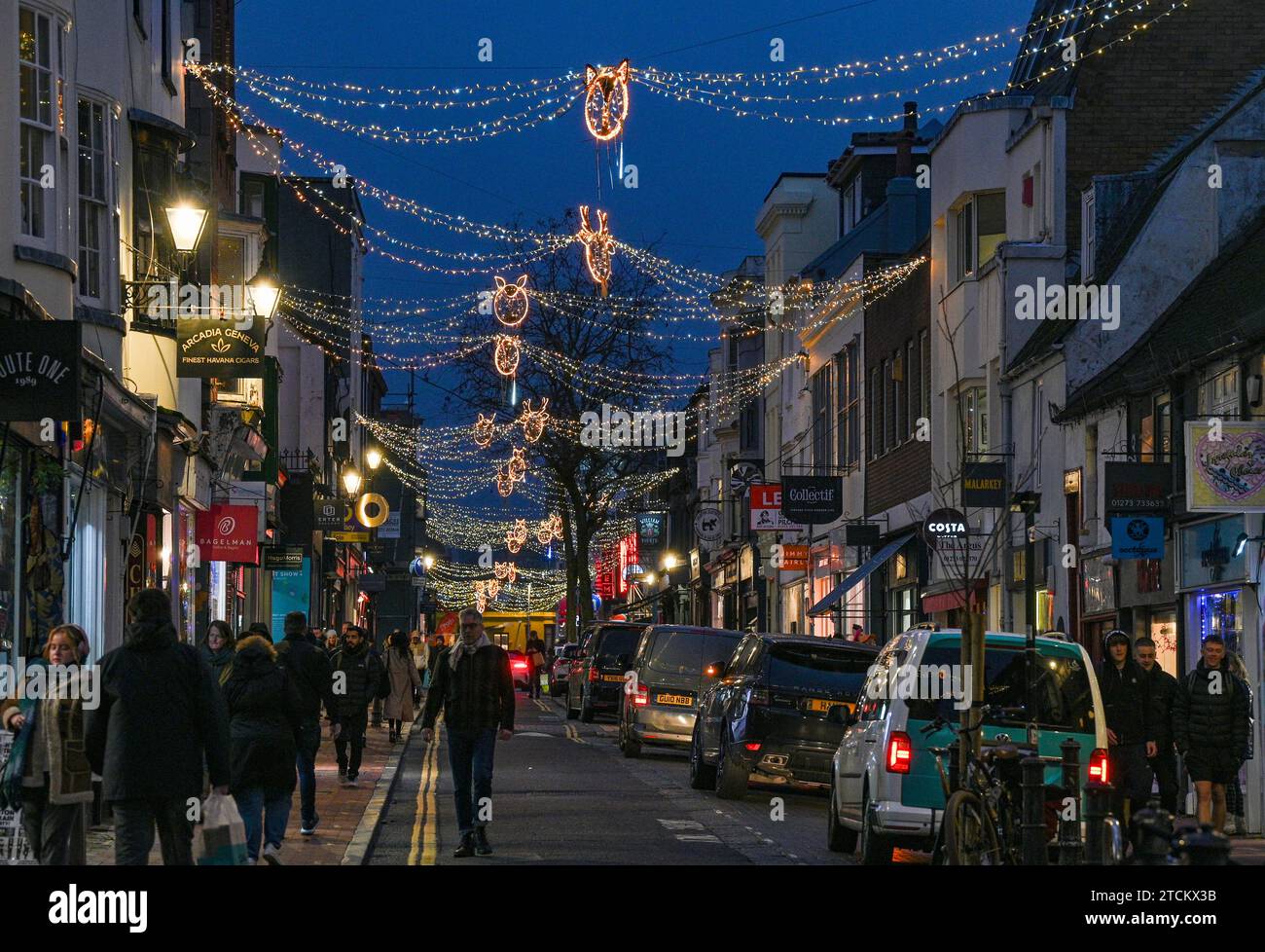 Brighton UK 13th December 2023 - Christmas shoppers in the North Laine area of Brighton as the festive season is in full swing throughout the UK : Credit Simon Dack / Alamy Live News Stock Photo