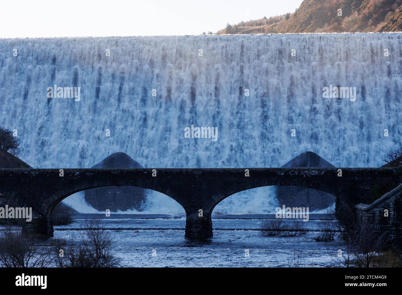 Caban Coch Dam, Elan Valley, Rhayader, Powys, Wales, UK.  13 December 2023.  UK weather: Caban Coch Dam in overflow this afternoon, following heavy rain.  Credit: Andrew Bartlett/Alamy Live News Stock Photo