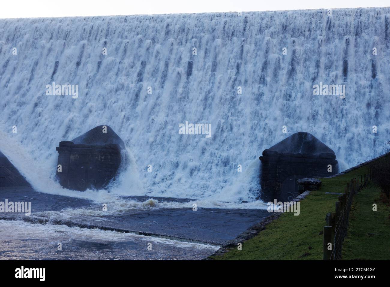 Caban Coch Dam, Elan Valley, Rhayader, Powys, Wales, UK.  13 December 2023.  UK weather: Caban Coch Dam in overflow this afternoon, following heavy rain.  Credit: Andrew Bartlett/Alamy Live News Stock Photo