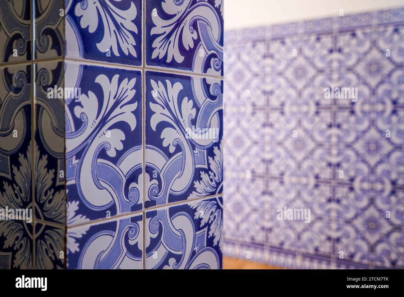 Portuguese house Traditional tiles. Retro old vintage wall blue tiles. Portugal style interior hydraulic ceramic mosaic tiles. Stock Photo