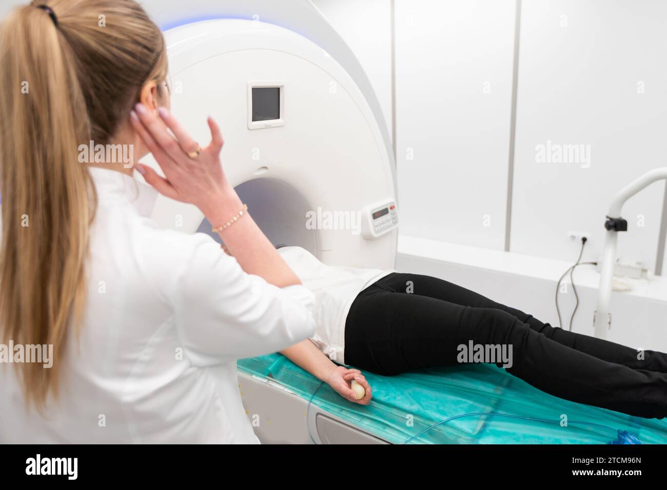 Female patient undergoing MRI - Magnetic resonance imaging in Hospital ...