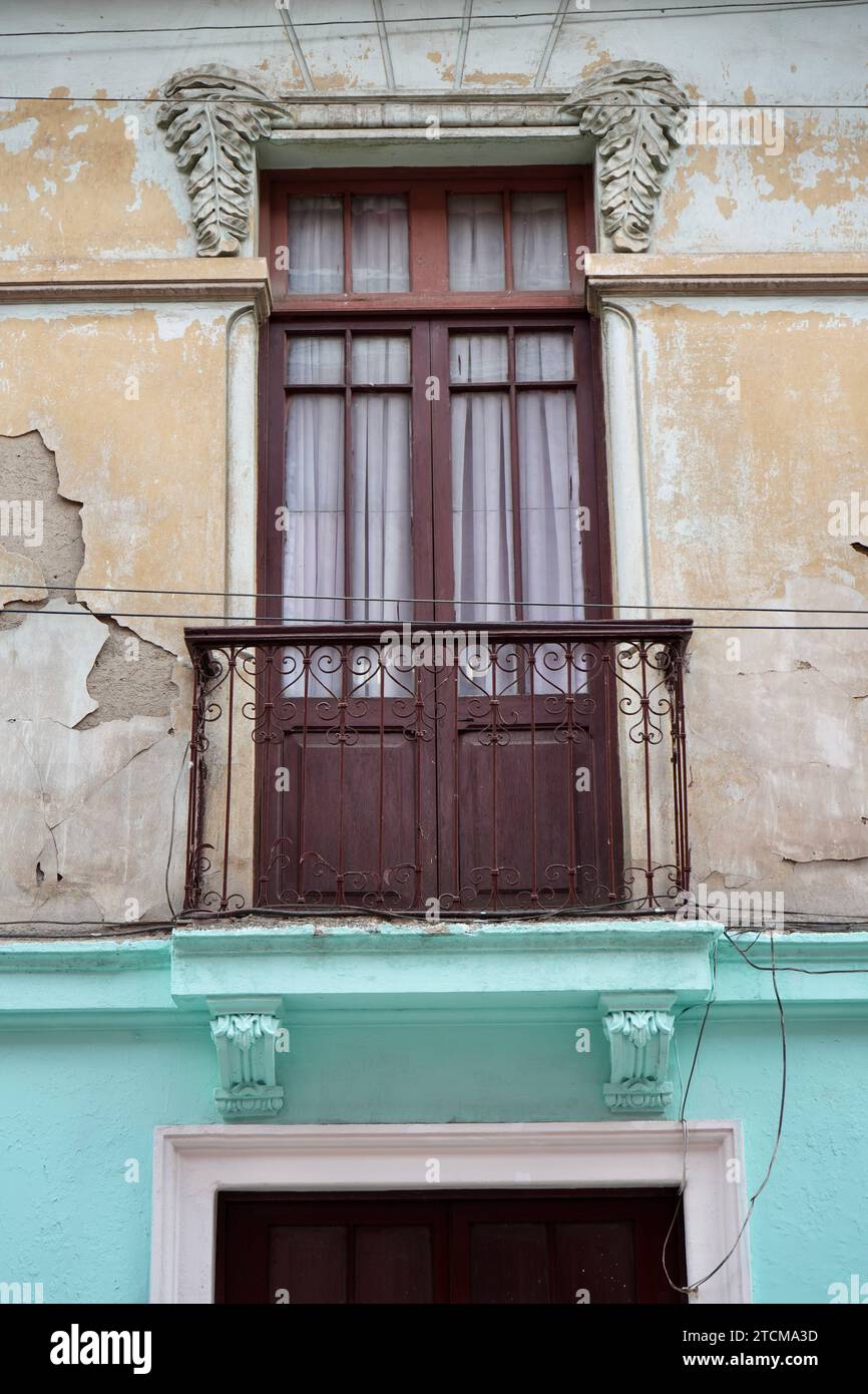 Traditional Wooden door with wrought iron scrolled balcony, Bolivia