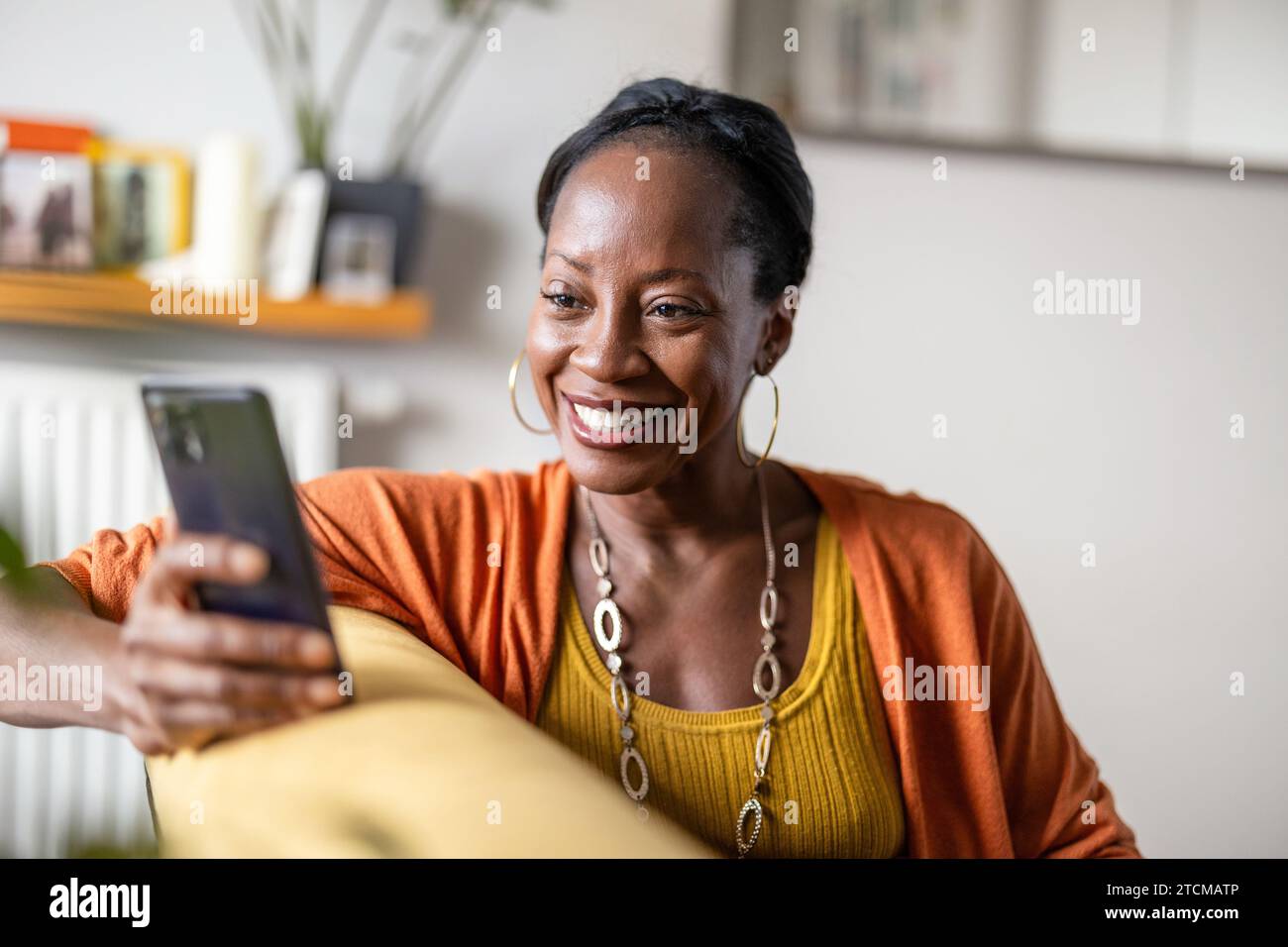 Relaxed mature woman smartphone hi-res stock photography and images - Alamy