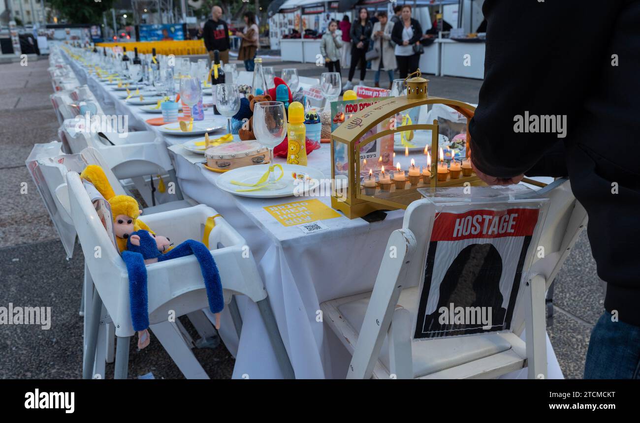 Tel Aviv, Israel. 13th Dec, 2023. A Hanukkiah candelabra is lit with