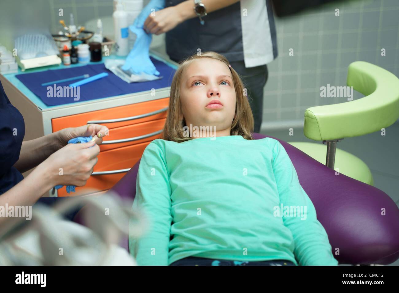 Little scared girl sitting in chair in dentist doctor office. Kid,child ...