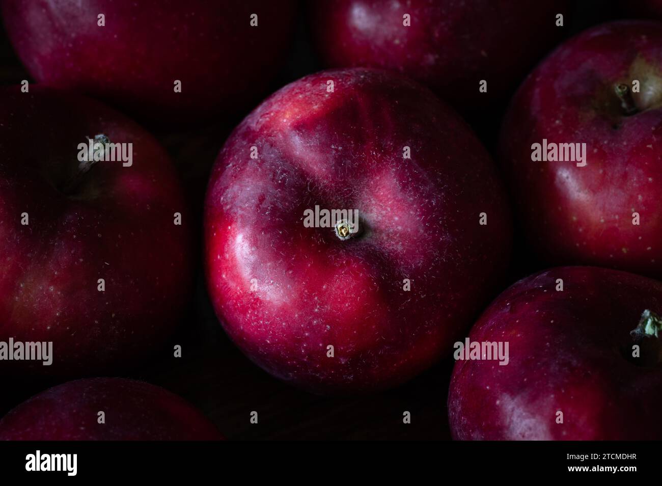 Top view of a red apple surrounded by other apples Stock Photo