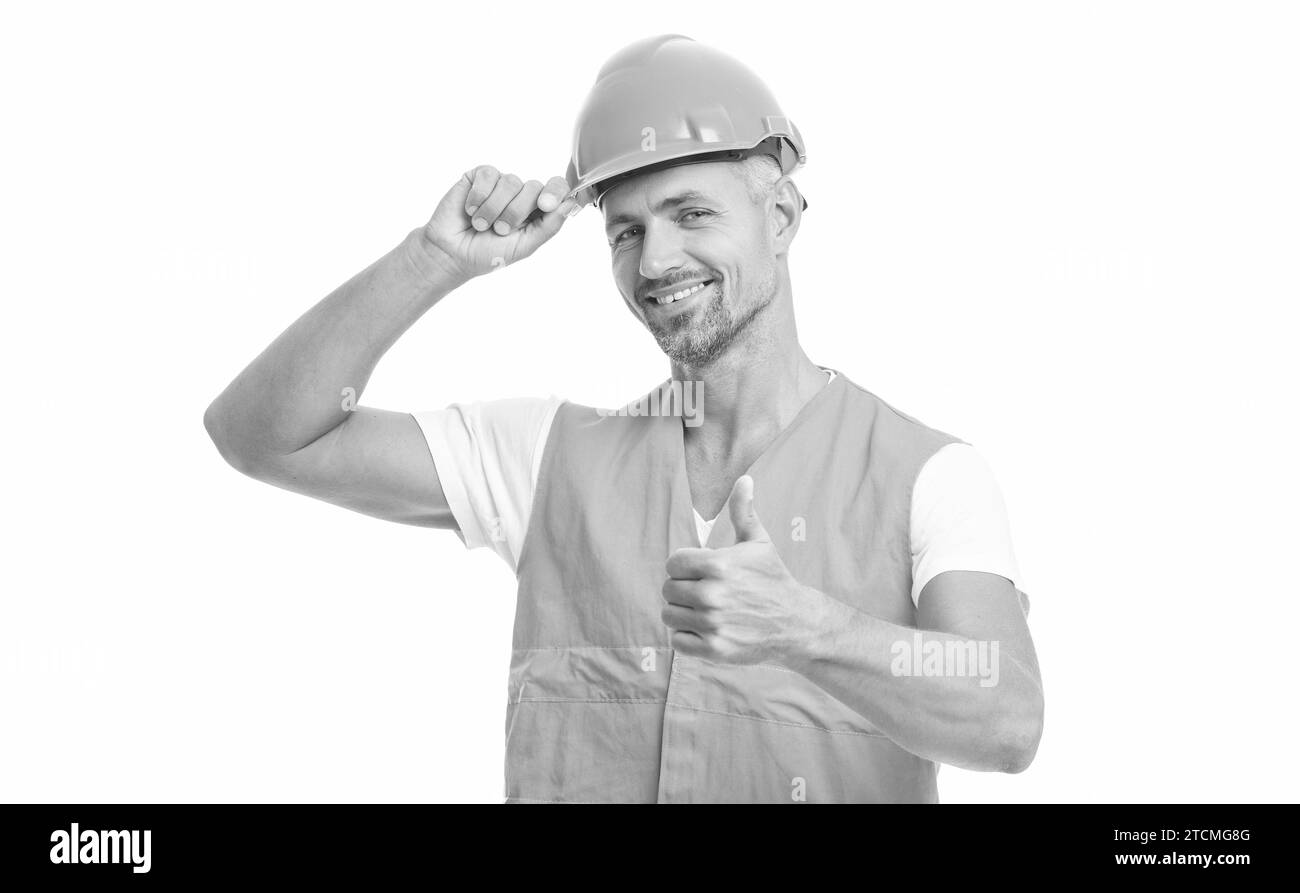 man laborer on background, thumb up. photo of man laborer wearing reflective vest. man laborer isolated on white. man laborer in white studio. Stock Photo