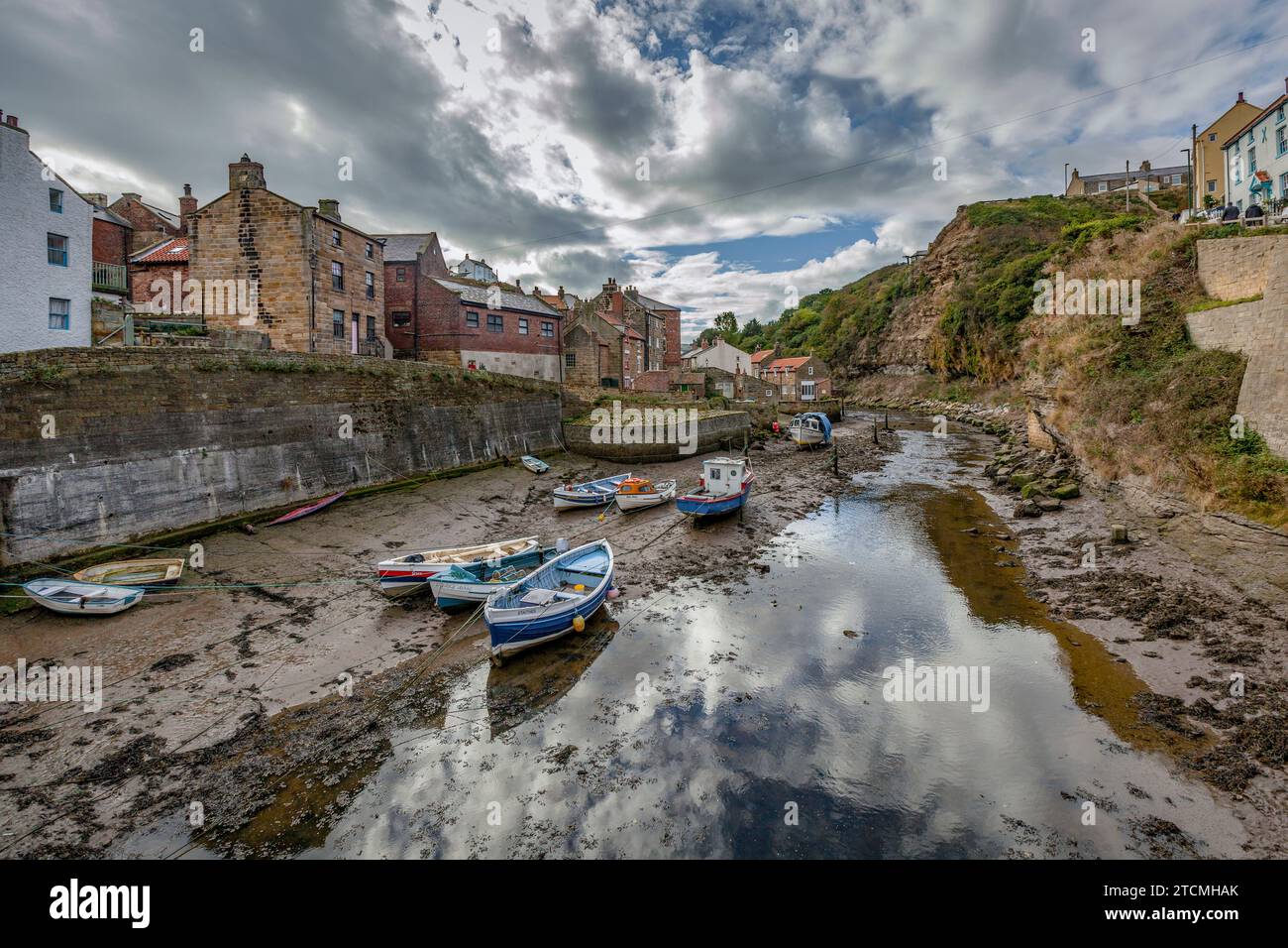 Fishing boats at low tide, Staithes, North Yorkshire Stock Photo - Alamy
