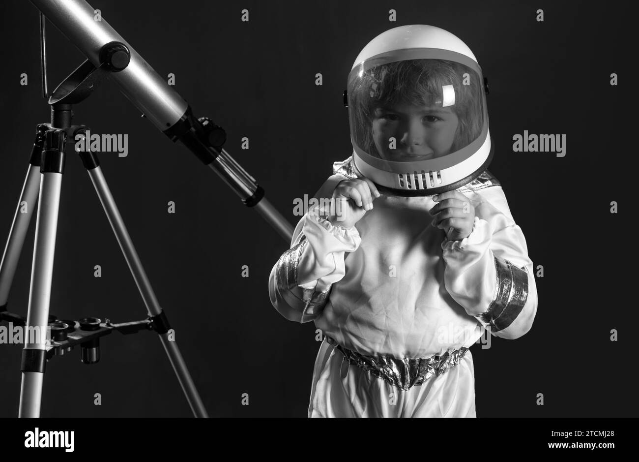 Space kids cosmonaut concept. Portrait of positive little boy with a ...