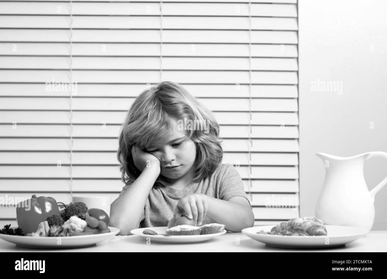 Portrait of kid with no appetite. Concept of loss of appetite. Child