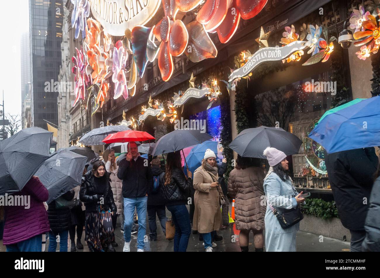 Thousands of tourists and New Yorkers view the Saks Fifth Avenue Christmas display during the Holiday Open Streets on Sunday, December 3, 2023. New York City closed a nine-block stretch of Fifth Avenue in Midtown to vehicles for four Sundays in December creating a holiday block party for visitors. (© Richard B. Levine) Stock Photo