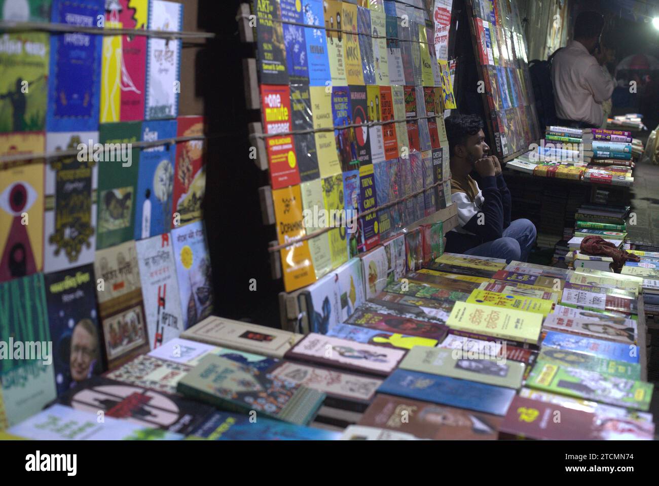 Dhaka, Bangladesh. 14th Dec, 2023. A vendor waits for