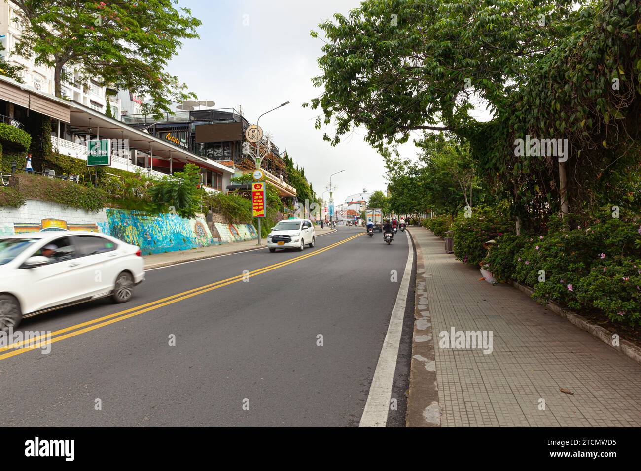 Da Lat city, Vietnam, May 27 2023 : the slope going up to the Hoa Binh center in the early morning Stock Photo