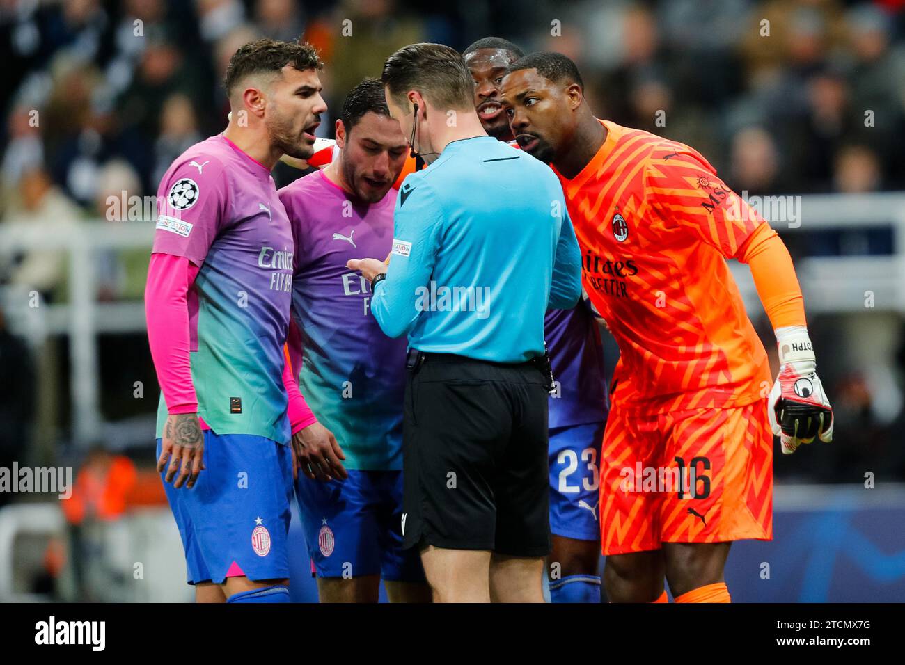 Newcastle, England. 13th December 2023; St James' Park, Newcastle, England; UEFA Champions League Football, Newcastle United versus AC Milan; Mike Maignan of AC Milan (right) protests to Referee Danny Makkelie after he is booked Credit: Action Plus Sports Images/Alamy Live News Stock Photo