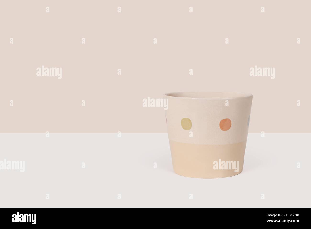 Beige empty ceramic flower pot isolated on light beige background Stock Photo