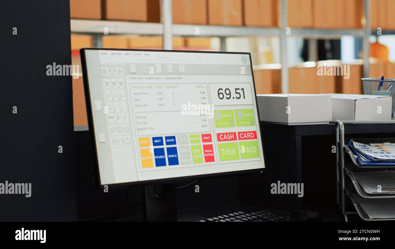 Computer with cash app in empty storehouse space, multiple carton boxes on racks and storage