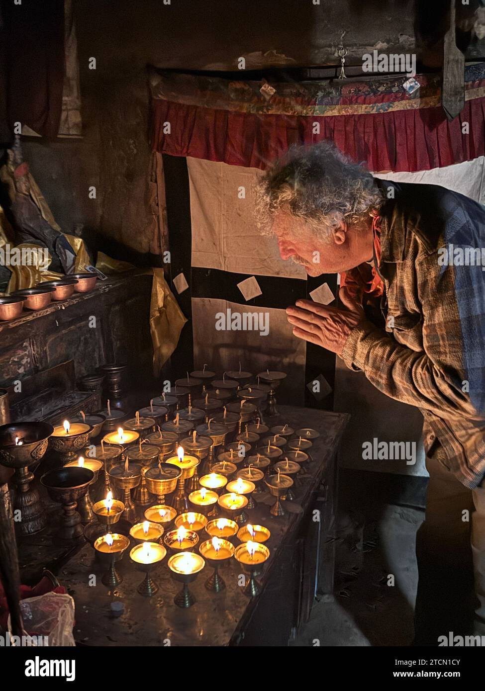 Craig Lovell doing Puja for Jade Lovell the day she passed away at Luri Gompa above Yara village - Mustang District, Nepal Stock Photo