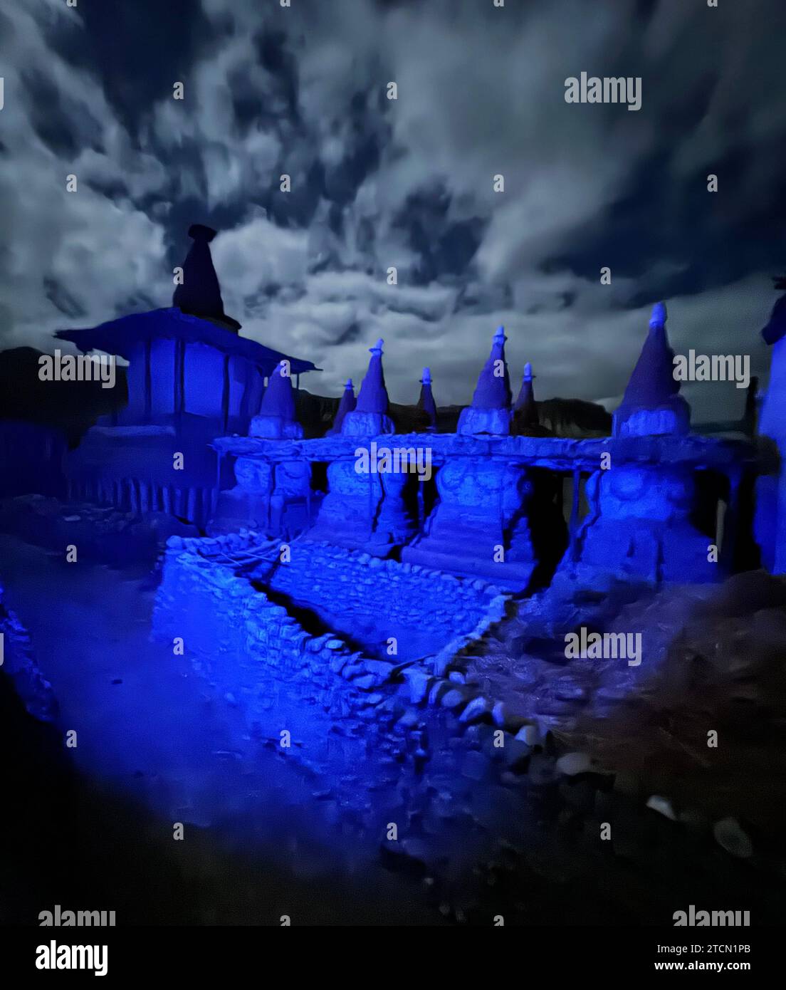 Night shot of chortens which are three dimentional mandalas representing the various states of the human condition with the top being the heavenly rea Stock Photo