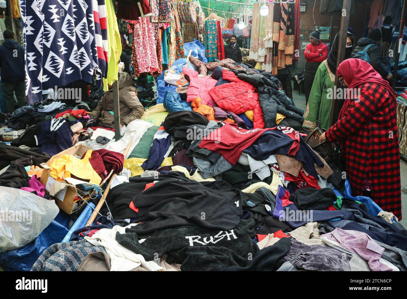 Sale of Winter Clothing During the Winter Season December 13 2023 Srinagar Kashmir India People shop for winter caps and other items at a market in Srinagar. With the arrival of winter