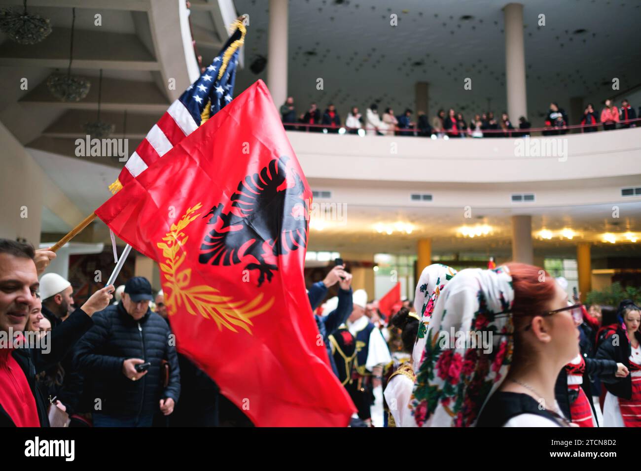 Tirana, Albania November 28 People in traditional attire dancing in a circle with Albanian