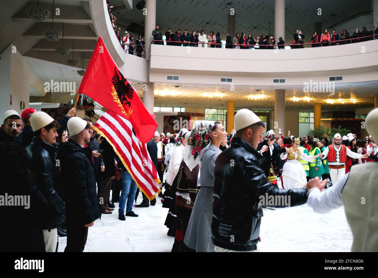 Tirana, Albania November 28 People in traditional attire dancing in a circle with Albanian