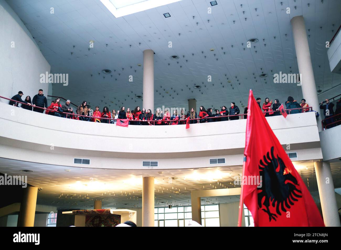Tirana, Albania - November 28: Crowd on the balcony with flags watching