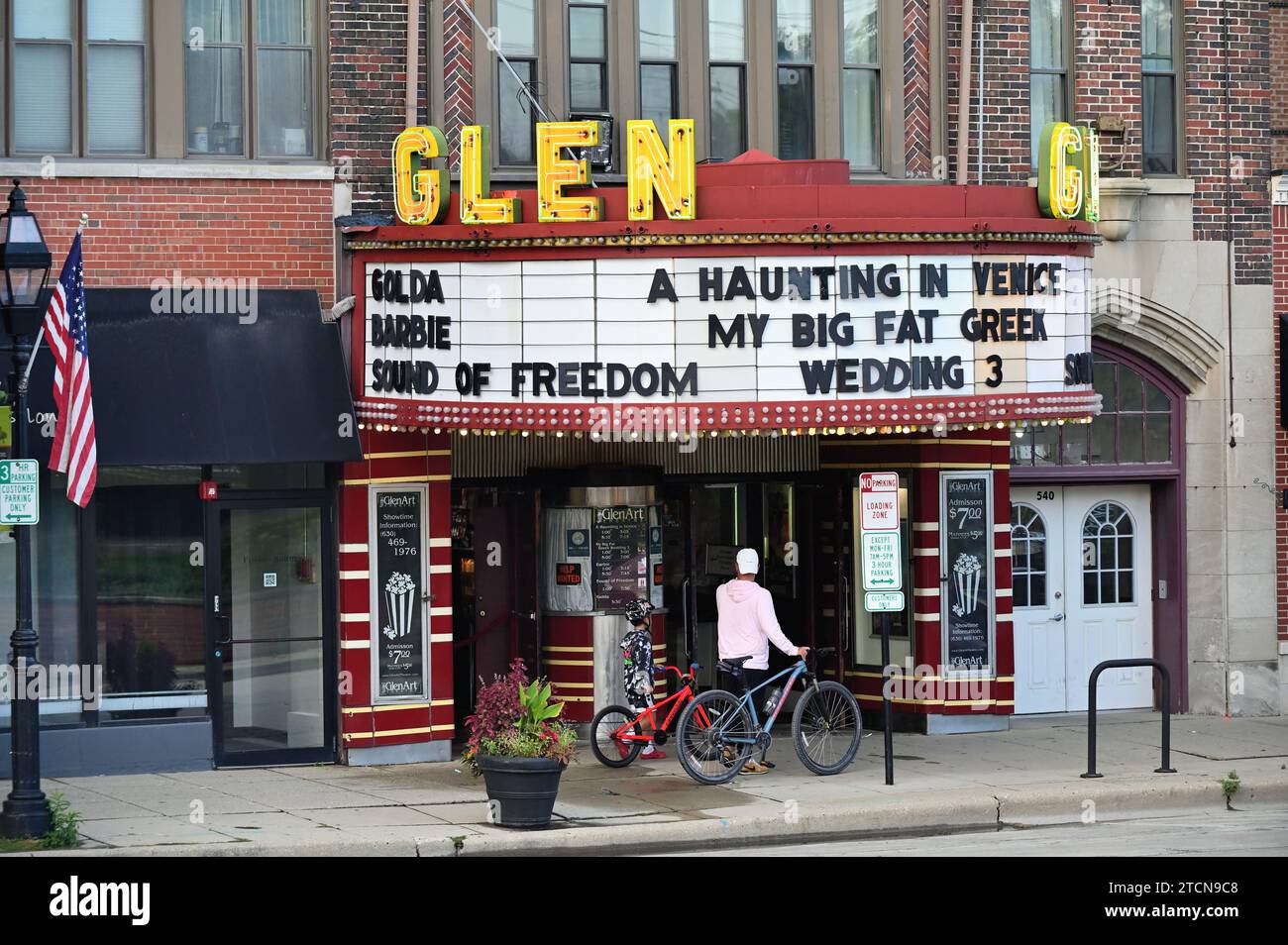 Glen Ellyn, Illinois, USA. A father and son pause their bike ride to