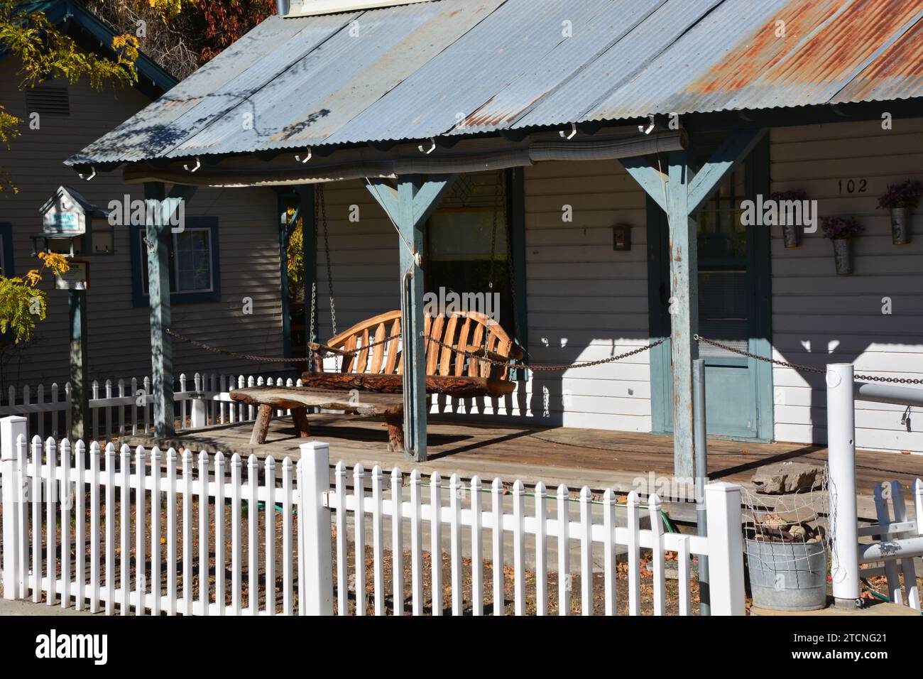 Porch swing on an old home in rustic wild west town of Winthrop Washington USA Stock Photo
