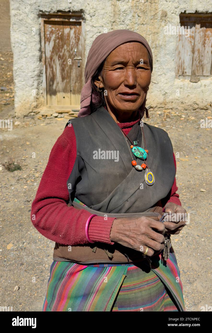 Buddhist woman in Sam Dzong village located near the border to Tibet in upper Mustang District, Nepal Stock Photo
