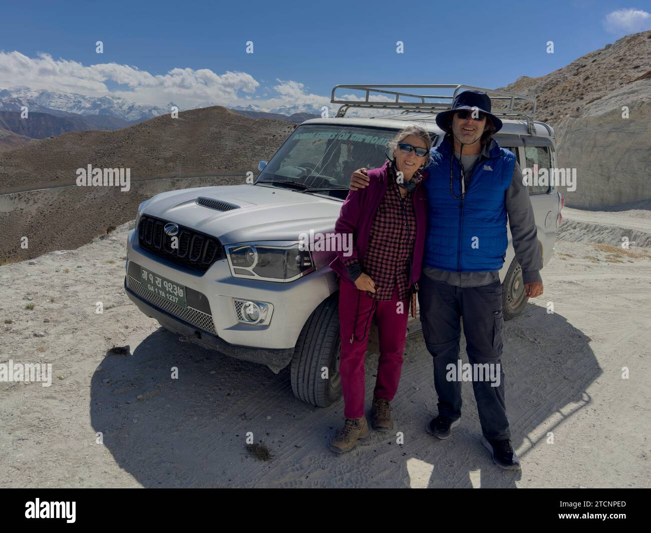 Bodhi Garrett and Christine Kolisch on the rough roads of upper Mustang, Nepal Stock Photo