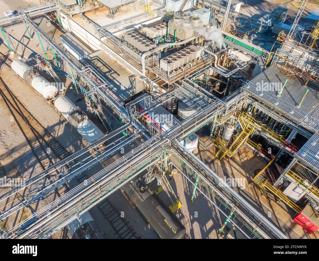 drone images of a large pharmaceutical manufacturing factory with lots of pipes, cool angles, and interesting shadows. Stock Photo