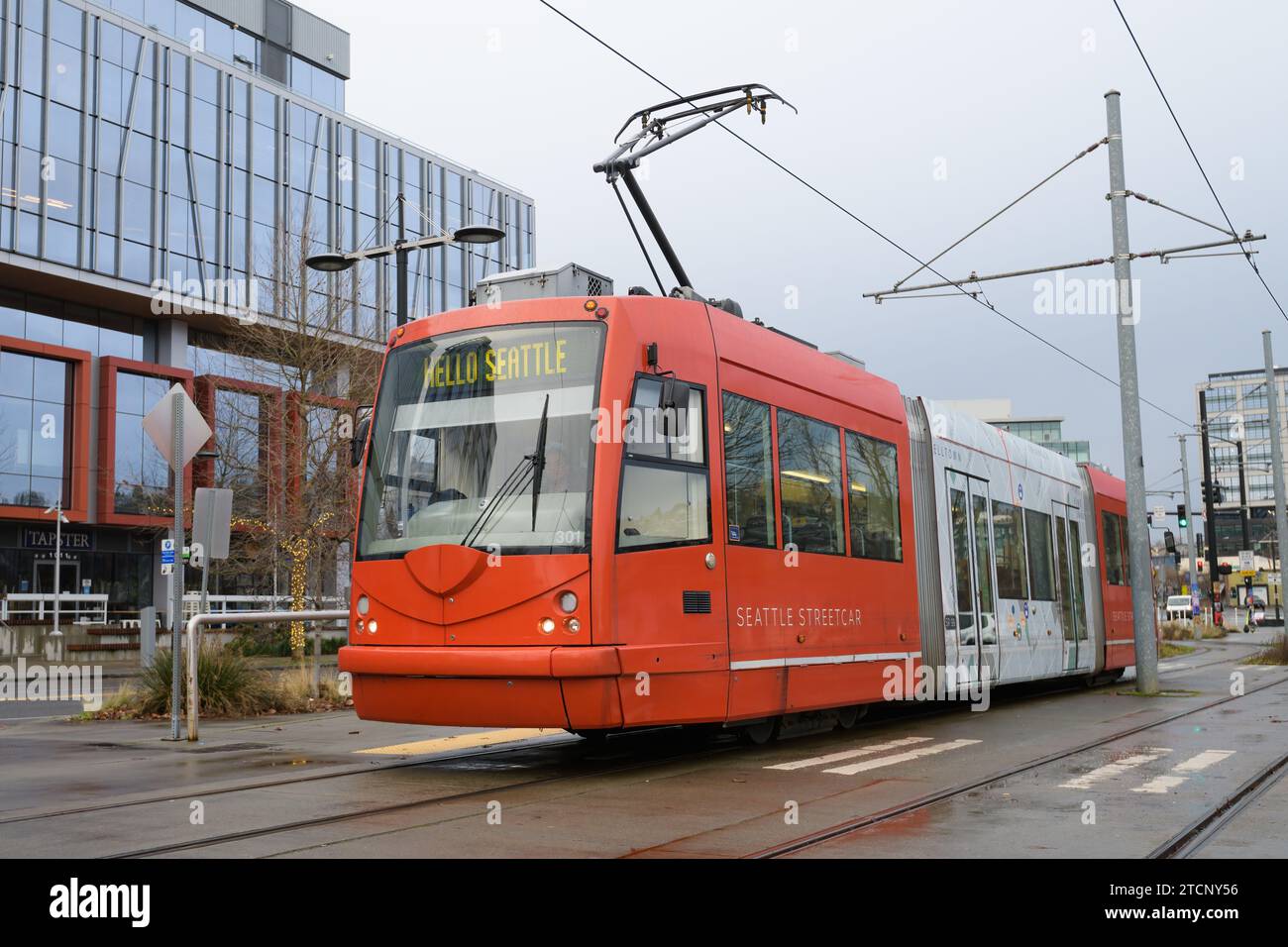 Seattle - January 15, 2023; Orange South Lake Union streetcar with pantograph raised Stock Photo