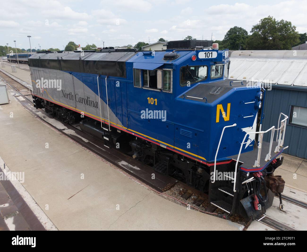 drone photos of various rail cars and amtrak trains on a cloudy day in ...
