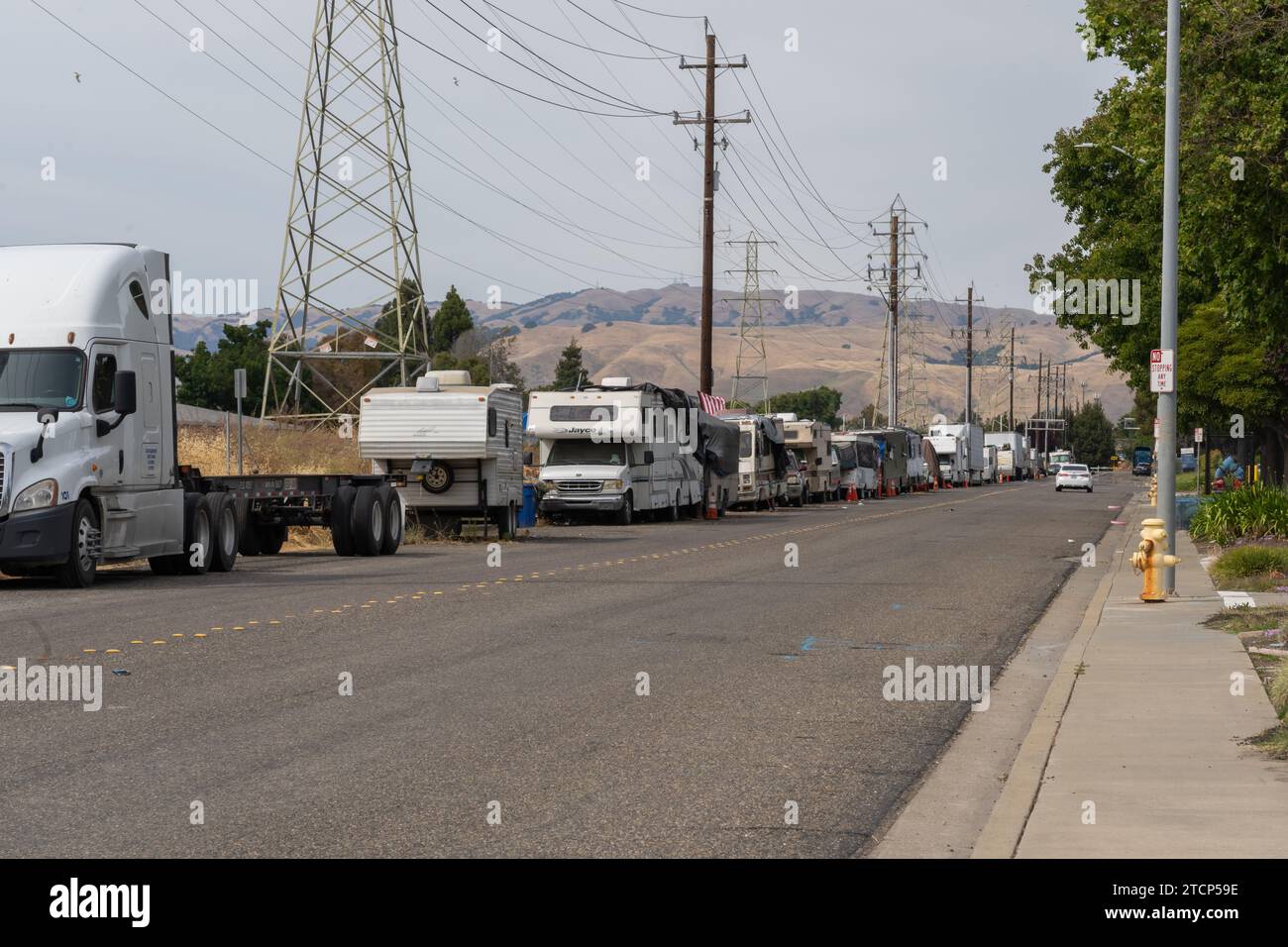 RVs and trailers are parked along Stewart Ave. in Fremont, California