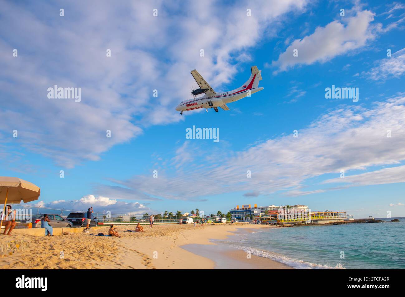 Winair (Windward Islands Airways) ATR 42 flying over Maho Beach before ...