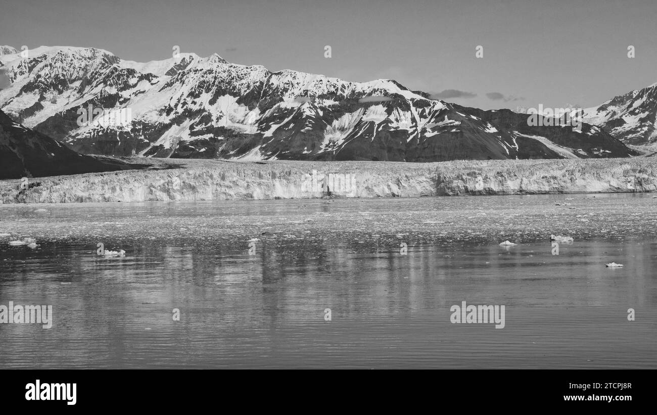 Mountain glacier calving and ice in sea ocean water scenery nature. Mountain coast natural landscape Stock Photo