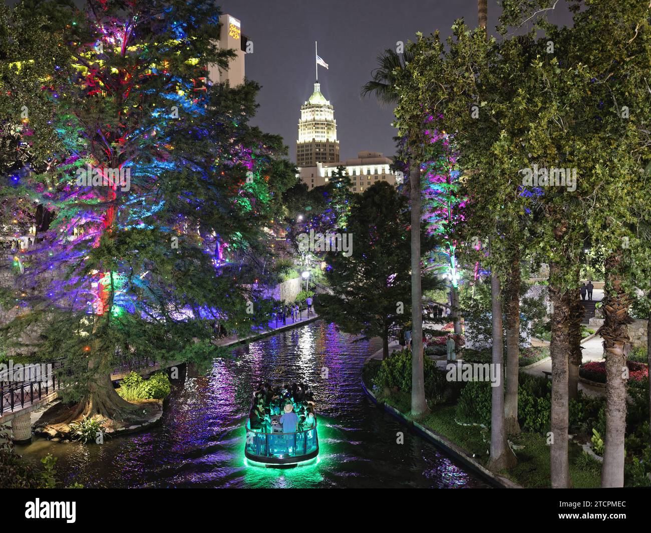 Riverboat on the San Antonio River with the Tower Life Building in the Background at Night, Riverwalk , San Antonio, Texas Stock Photo