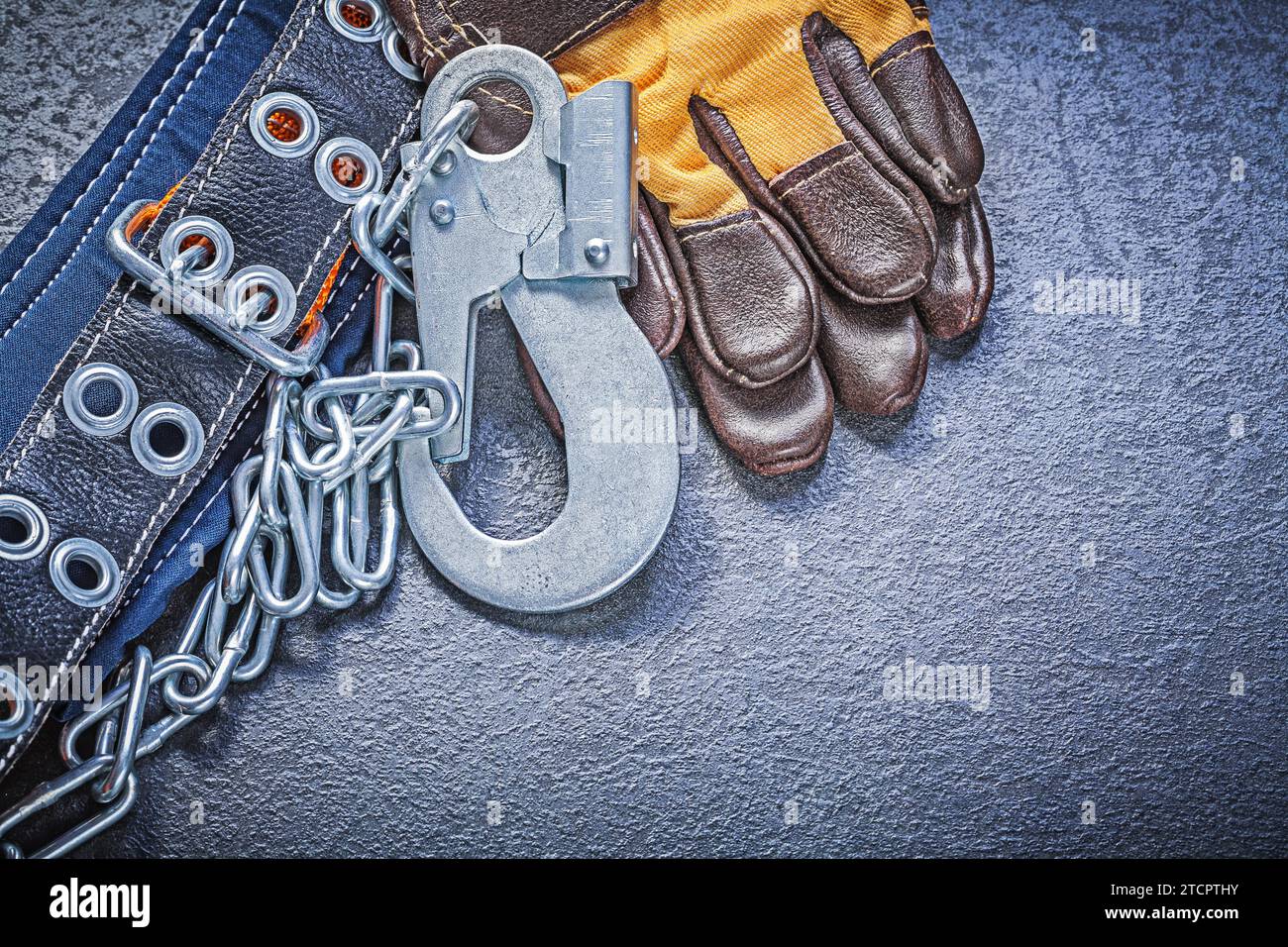Construction body belt safety leather gloves on black background maintenance concept Stock Photo