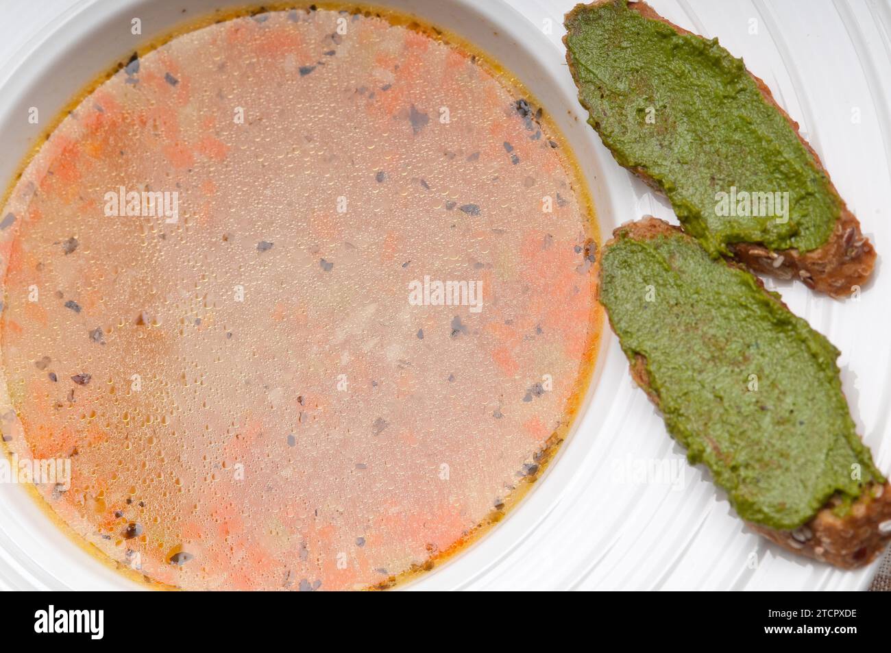 Classic Italian minestrone passato soup with pesto crostini on side