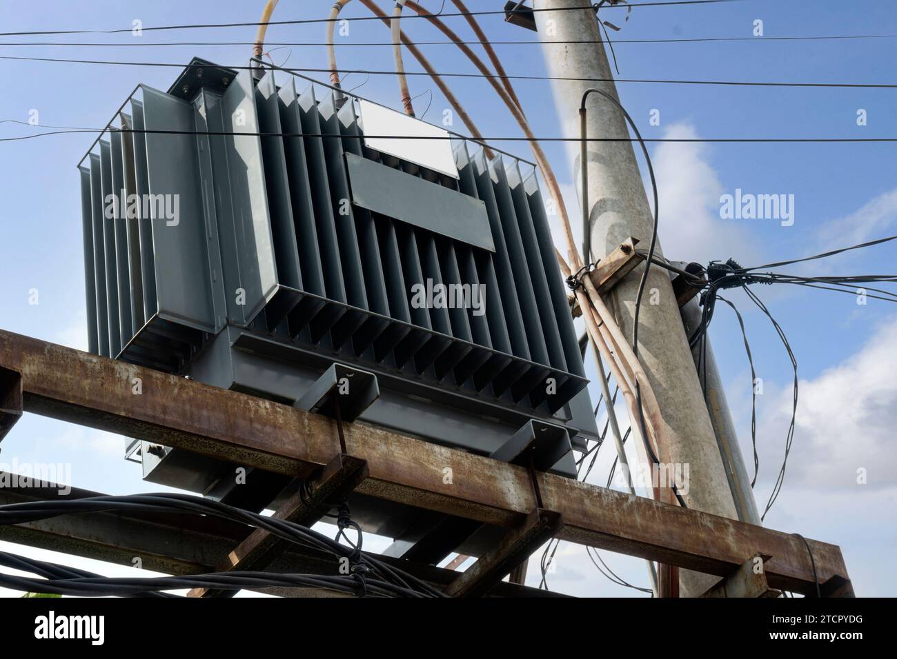 High voltage power lines tower with a blue sky background Stock Photo ...