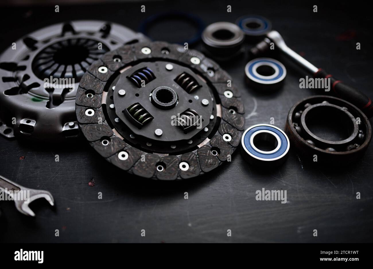 New clutch kit in a car service with a flywheel bearing before being