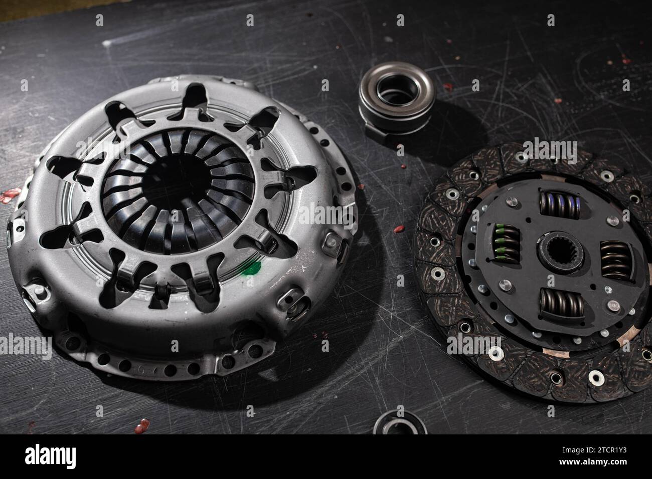 New clutch kit in a car service with a flywheel bearing before being