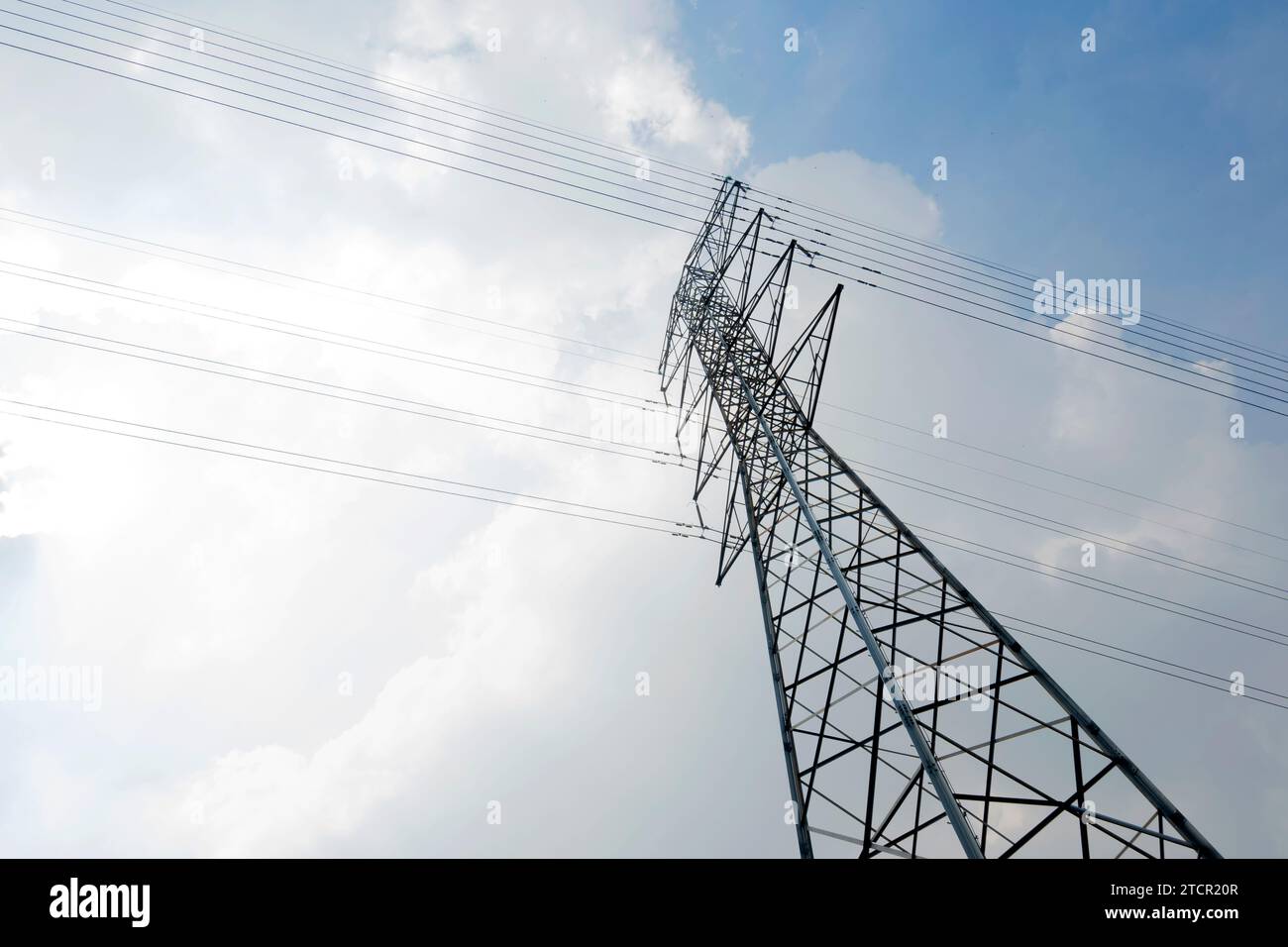 High voltage power lines tower with a blue sky background Stock Photo ...