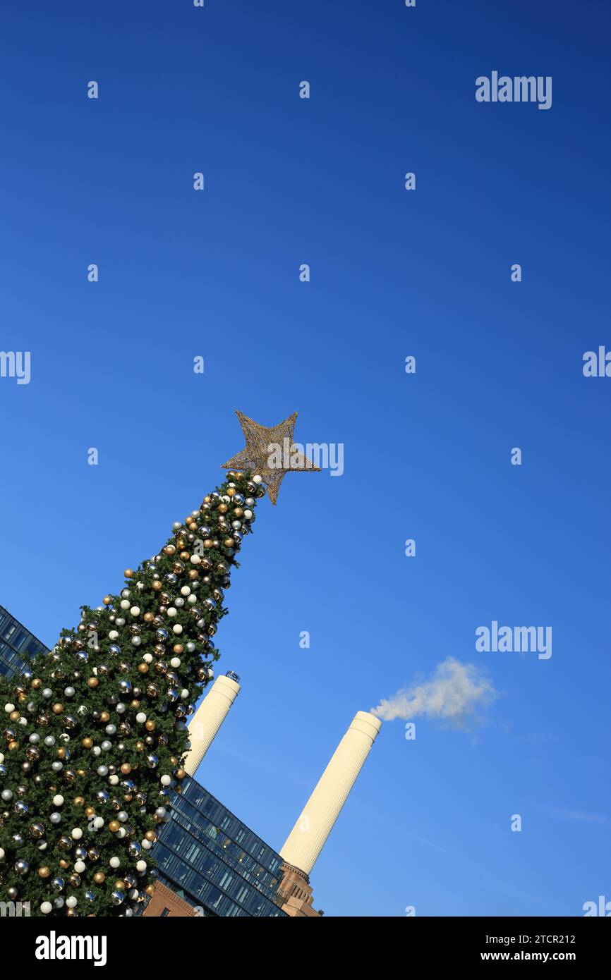 Christmas tree with Battersea Power Station development and blue sky