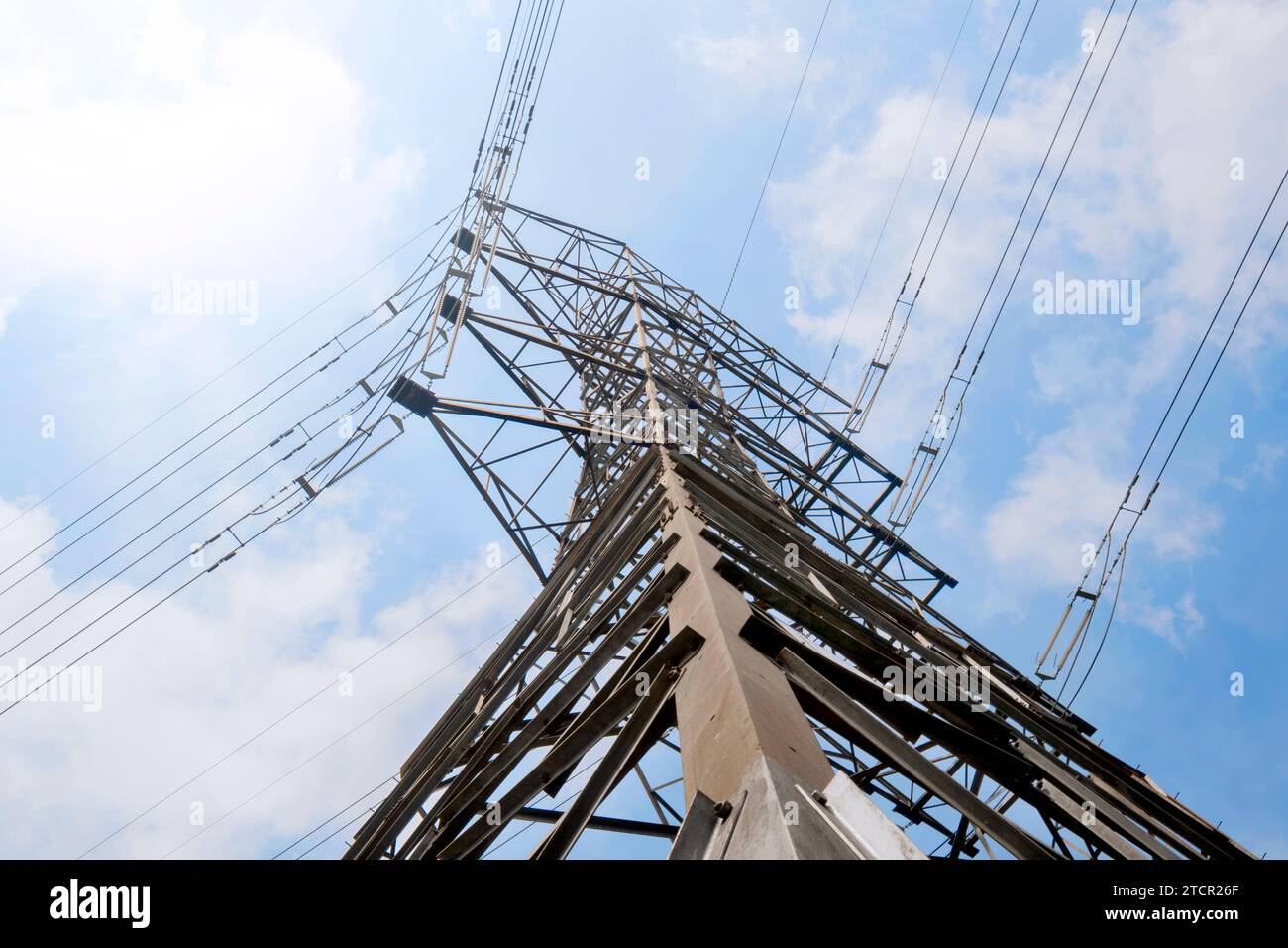 High voltage power lines tower with a blue sky background Stock Photo ...