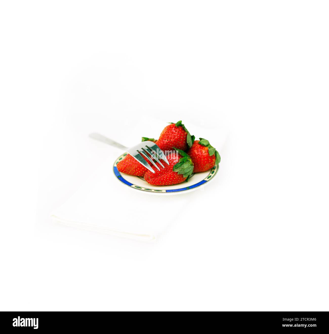 Fresh strawberries on little dish isolated over white Stock Photo