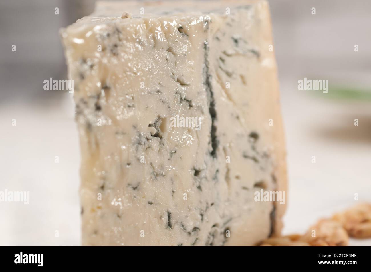 Piece of Italian gorgonzola cheese fresh cut and pinenuts Stock Photo