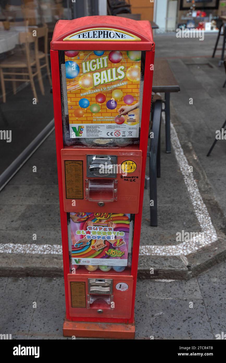 Chewing gum vending machine in front of a restaurant, Portofino, Italy