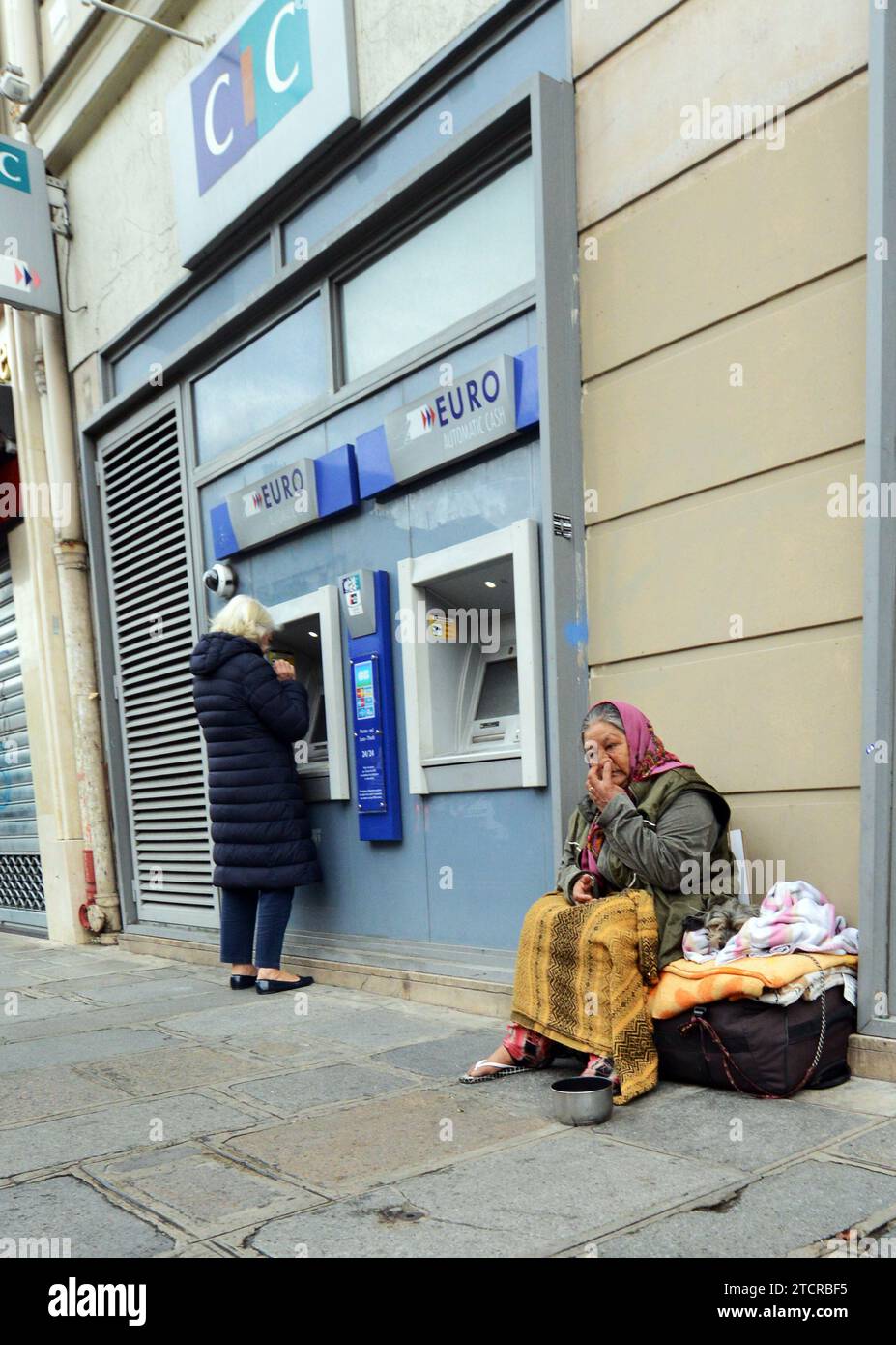 A migrant begging for money in Paris, France. Stock Photo